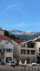 Street corner documented in Budva, Montenegro under cloudy skies