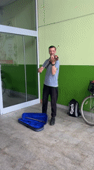 Street musician performs violin on Podgorica sidewalk