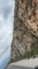 Vehicle travels winding hillside road in Bulgaria