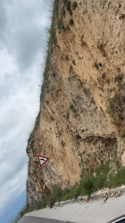 Vehicle travels winding hillside road in Bulgaria