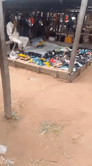 Afternoon street life and mobile charging in Jalingo