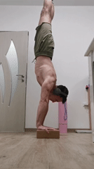 Man performs indoor handstand in Burgas, Bulgaria