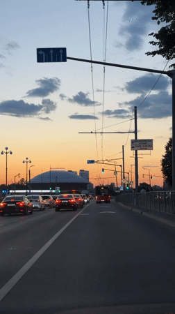 Dusk drive through Kazan captures evening traffic scene