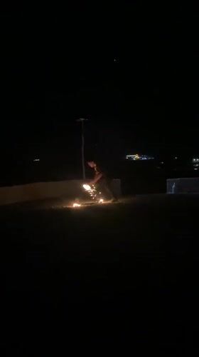 Nighttime fire spinning show lights up rural Morocco