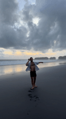 Two people enjoy morning beach time in Indonesia