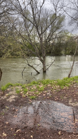 Person exercises at flooded park fitness area in Elhovo