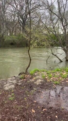 Person exercises at flooded park fitness area in Elhovo