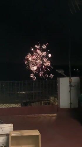 Fireworks over Sabadell, watched from balconies on a June night