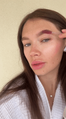 Woman does eyebrow grooming routine in Elliniko Greece