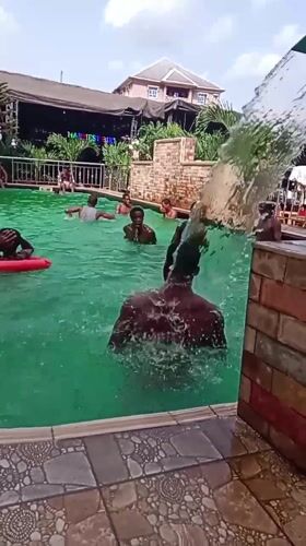 Young men enjoy afternoon swim session in Onitsha pool