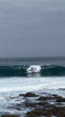 Bodyboarding and surfing session at Arica's rocky coastline