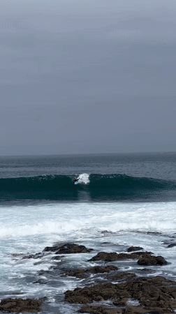 Bodyboarding and surfing session at Arica's rocky coastline