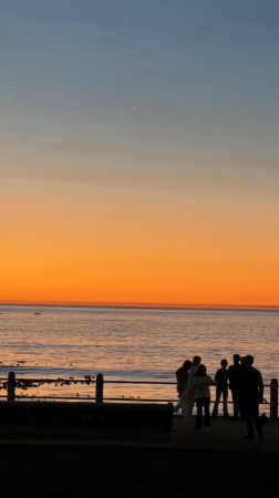 Cape Town residents gather for sunset viewing at waterfront