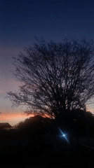 Sunset documented in Juan Griego, Venezuela with discarded baseball