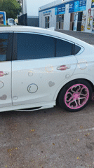 Customized white sedan with pink accents spotted in Miami
