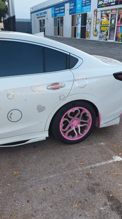 Customized white sedan with pink accents spotted in Miami