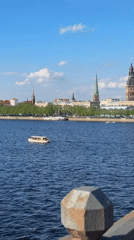 Tourist moments captured across Riga's historic riverfront and bridges