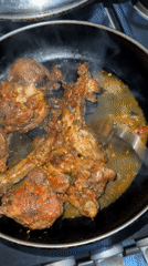 Spicy chicken dish prepared in Nigerian kitchen
