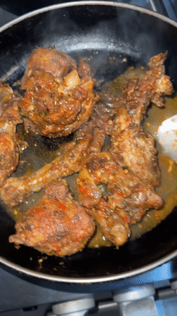 Spicy chicken dish prepared in Nigerian kitchen