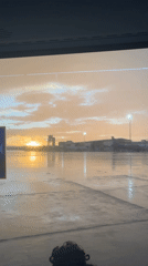 Rainbow appears over Spanish airport during evening storm