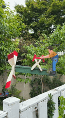 Wooden whirligig spotted on McLean fence displays chopping figure