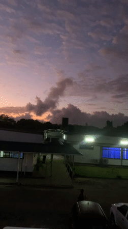 Illuminated building captured against colorful dusk sky in Kibaha