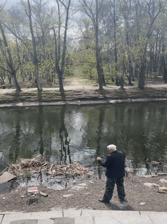 Spring morning at Yekaterinburg's Kharitonov Garden captures fishing, ducks, visitors