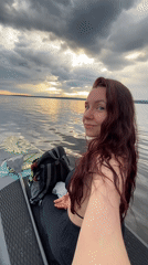 Woman paddleboards at sunrise near Chaikovsky, Russia