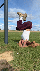 Woman exercises in field near Ляхово, Russia