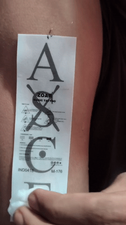 Person applies tattoos, takes selfies with K-pop merchandise in Depok