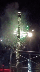 Illuminated sculptures and fireworks at a night festival in Ozernoe