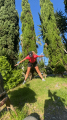 Woman performs morning stretching routine in Sochi park