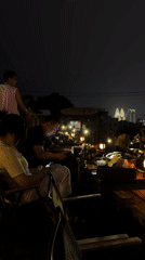 Evening rooftop bar gathering documented in Nan'an District