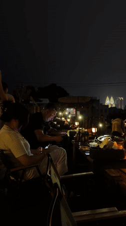 Evening rooftop bar gathering documented in Nan'an District