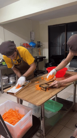 Early morning food prep and street life in Patong