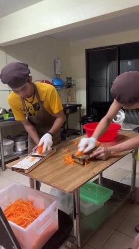 Early morning food prep and street life in Patong