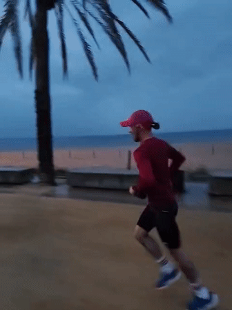 Runner spotted jogging on Calella beach wearing distinctive pink cap