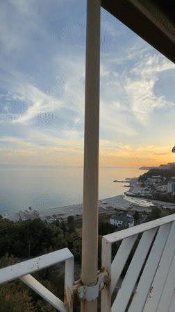 Sunset and observation tower documented in coastal Nebug, Russia