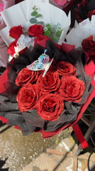 Flowers and yarn for sale at a Chiang Mai street market