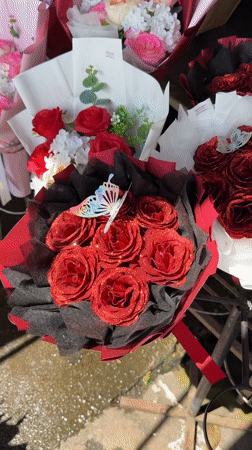Flowers and yarn for sale at a Chiang Mai street market