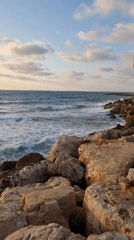 Serene sunset views captured along Tel Aviv's rocky Mediterranean coast