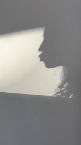 Person's profile shadow captured on wall in Podgorica