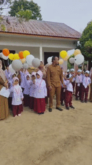 School assembly or celebration at an outdoor Islamic primary school