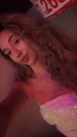 Late-night club scene in San Juan, neon lights and dancing.