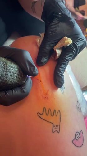 Late-night tattoo session documented in Belgrade's Vracar district