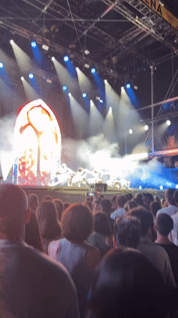 Dancers and performers light up a foggy, spotlit stage