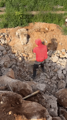 Manual demolition and rock-breaking work on a Jos construction site