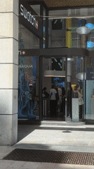 Customers shop at Swatch store in Milan