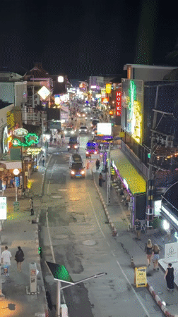 Elevated views capture street life and dining in Thai town