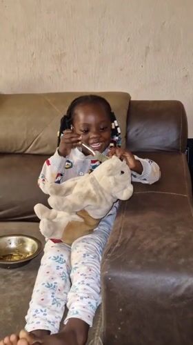 Morning meal at home in Jos, stuffed toy included